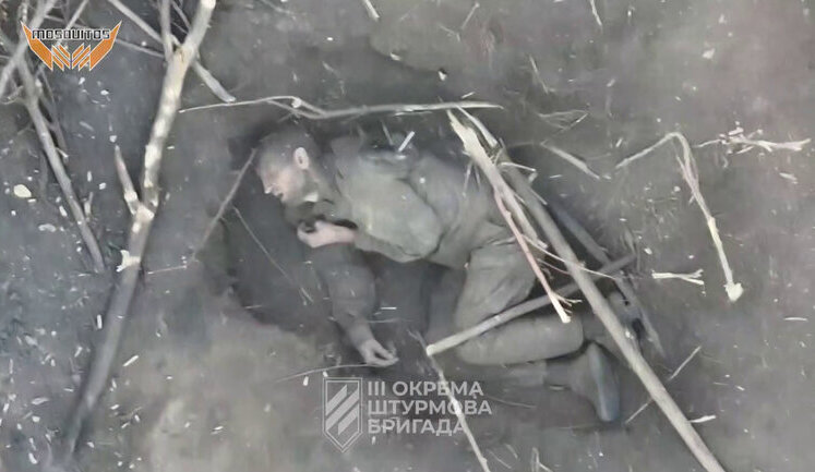 Russian infantryman dying in field in Kharkiv region as result of attack by fighters of 3rd SAB. VIDEO