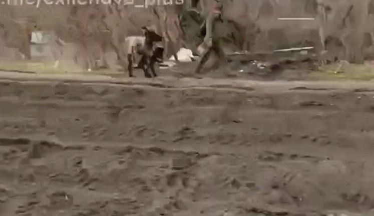 Russian stormtrooper on motorbike films accomplice pulling donkey on road. VIDEO