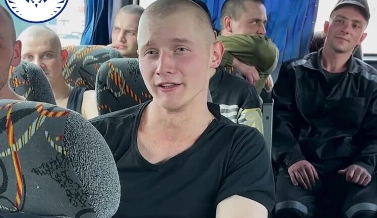 In first minutes on his native soil, soldier of Armed Forces of Ukraine, freed from captivity, sings "Chervona Kalyna". VIDEO