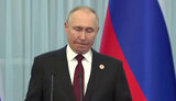путін