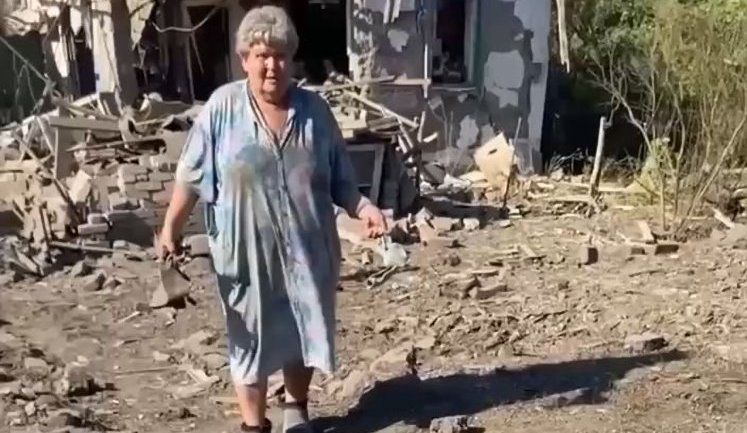 Ethnic Russian woman from Kramatorsk, who lost her son in air strike, stands amidst ruins of her home with fragments of aerial bomb: "May you all be damned, whole of Russia!". VIDEO