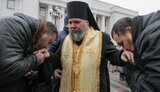 священники