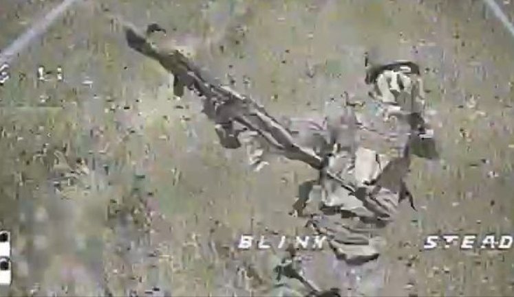 Moment before his death, invader tries in vain to hit Ukrainian drone with his assault rifle. VIDEO