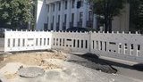 В результате прорыва трубопровода под проезжей частью возле Рады провалился асфальт. ФОТОрепортаж
