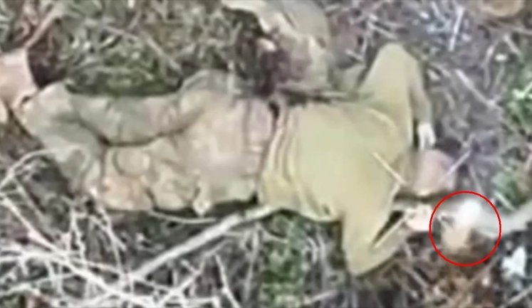 Munition dropped from drone hits wounded occupier in head. VIDEO 18+