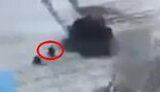 A Russian tank runs over its assaultman