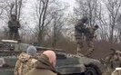 Soldiers unloading trophy Russians