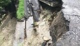 На Закарпатті сильний дощ зруйнував міст, в Ужгороді затопило кілька вулиць. ФОТОрепортаж