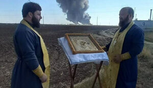 Priests of Russian Orthodox Church are "helping" to extinguish fire at oil depot in Rostov region, which has been burning for fourth day. PHOTO