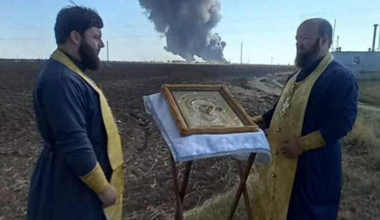 Priests of Russian Orthodox Church are "helping" to extinguish fire at oil depot in Rostov region, which has been burning for fourth day. PHOTO