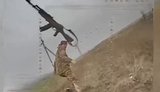 Russian throws an automatic rifle at drone