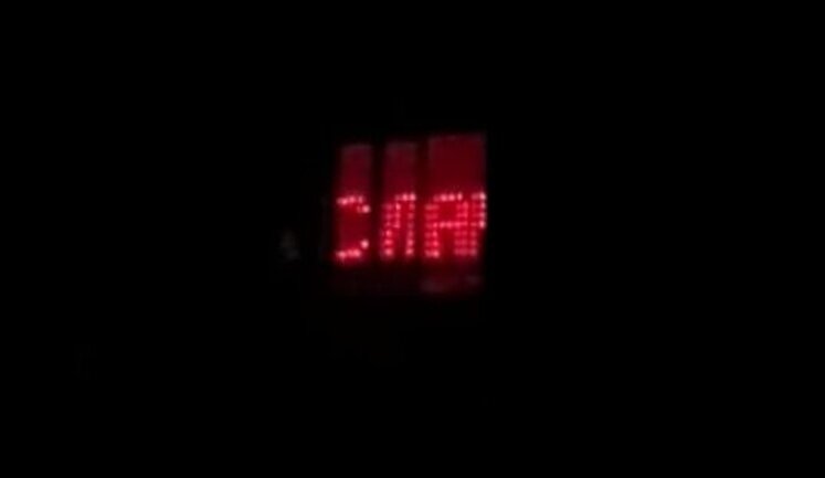 Kyivan put on light show with patriotic slogans in his window when lights in his house were turned off. VIDEO