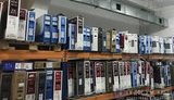 В інтернет-магазині, через який реалізовували техніку невідомого походження під виглядом відомих торгових марок, вилучено ТМЦ вартістю понад 24,4 млн грн і велику суму готівки. ФОТО