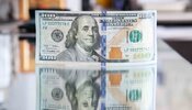 долар