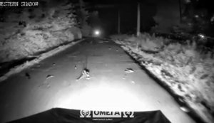 Local resident clears road and helps "Omega" fighters’ ground robot continue moving. VIDEO
