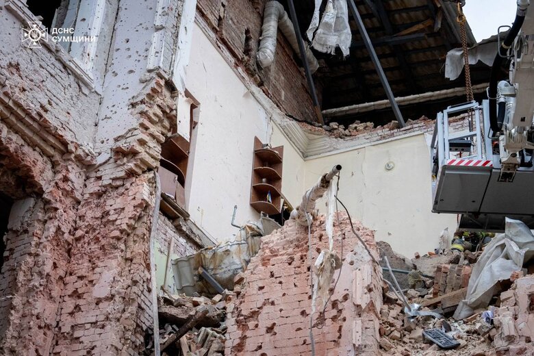 The flag of Ukraine on the ruins in Sumy