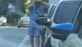 A Russian man tries to make out the start of the queue through his binoculars