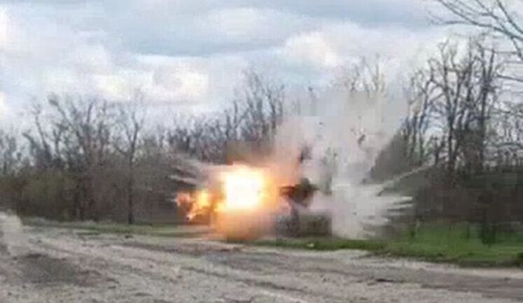 Occupier picks up unknown object, carries it to side of road and is blown up by explosion. VIDEO