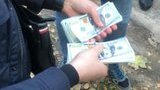 СБУ затримала на хабарі $4 тис. слідчого одного з відділень Нацполіції на Київщині. ФОТОрепортаж