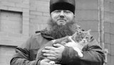 священник